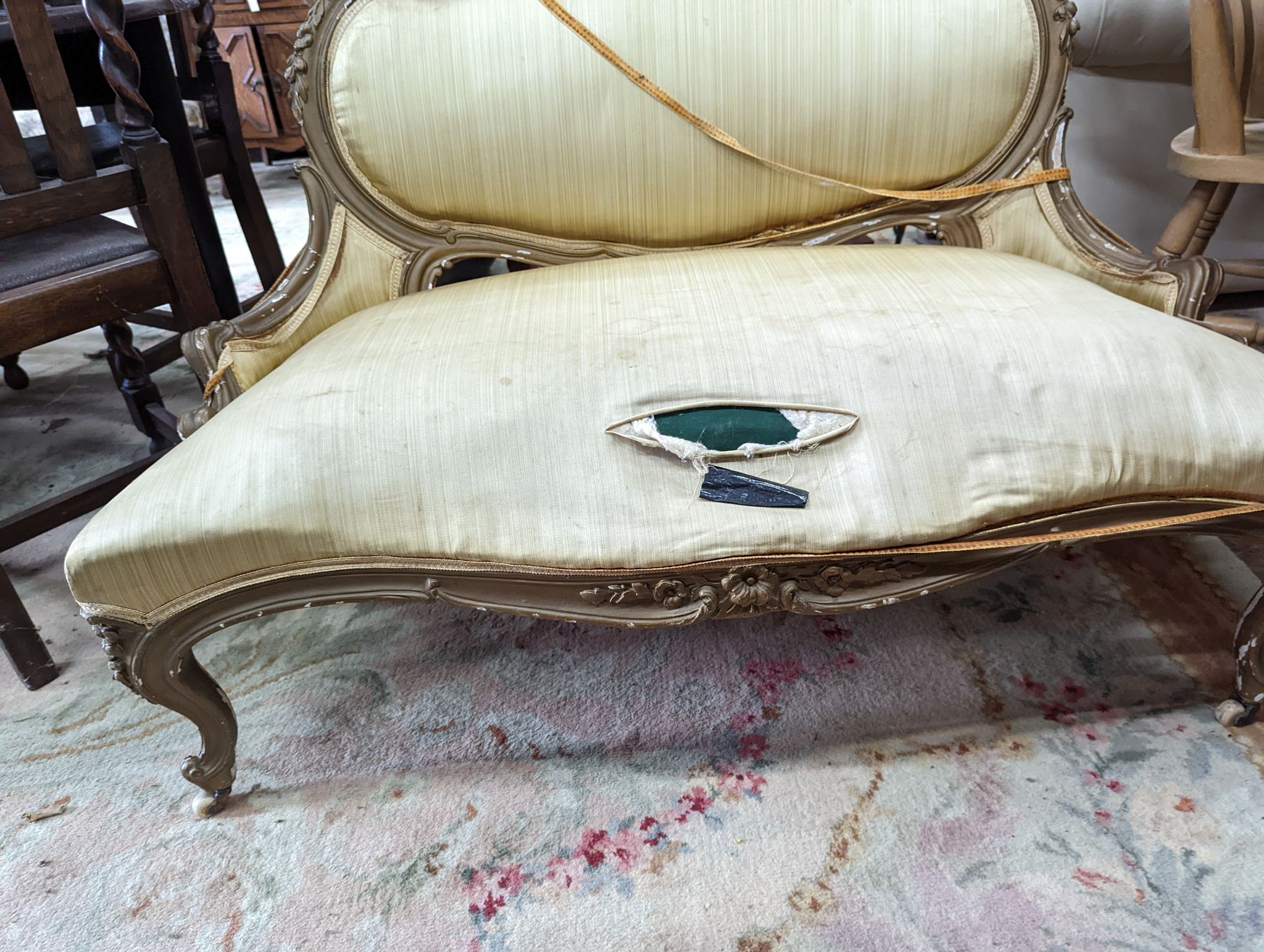 A 19th century giltwood and gesso French canape, length 120cm, depth 56cm, height 84cm